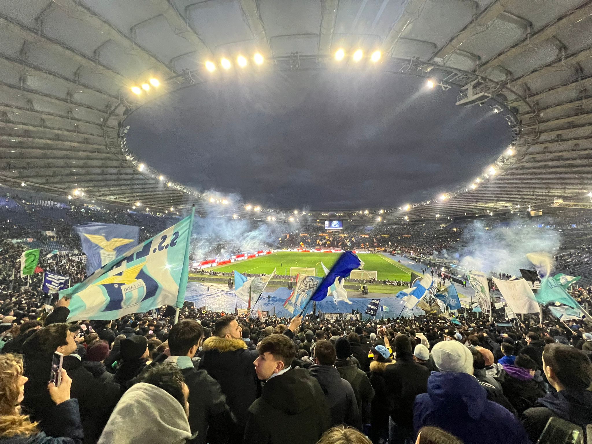 Lazio fans gathered before kick-off, proudly displaying sky-blue flags and banners as they build the atmosphere ahead of the match.