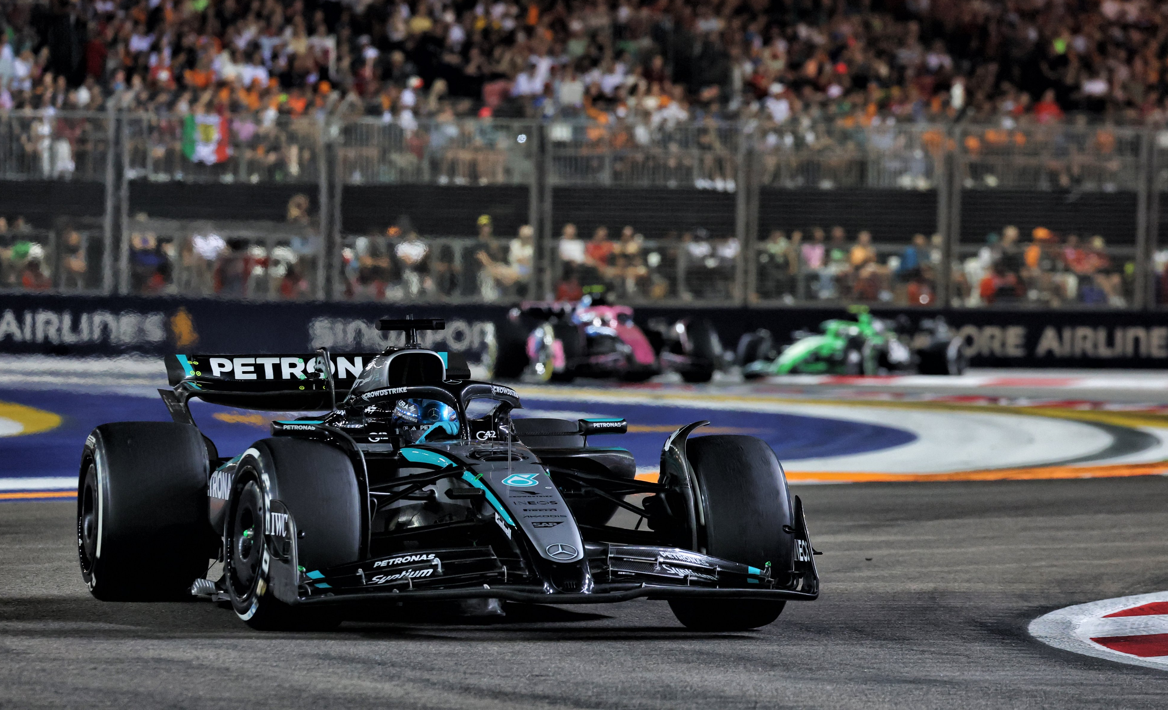 George Russell races on way to winning the 2025 Singapore Grand Prix.