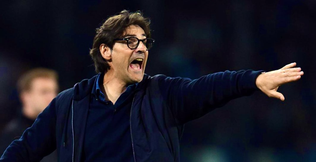 Paolo Vanoli, the new Fiorentina head coach, standing on the touchline and pointing to direct his team during a match.