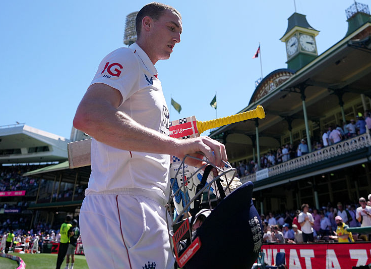 Harry Brook pictured walking off the field during England's fifth Ashes Test defeat in Sydney in January 4-8.
