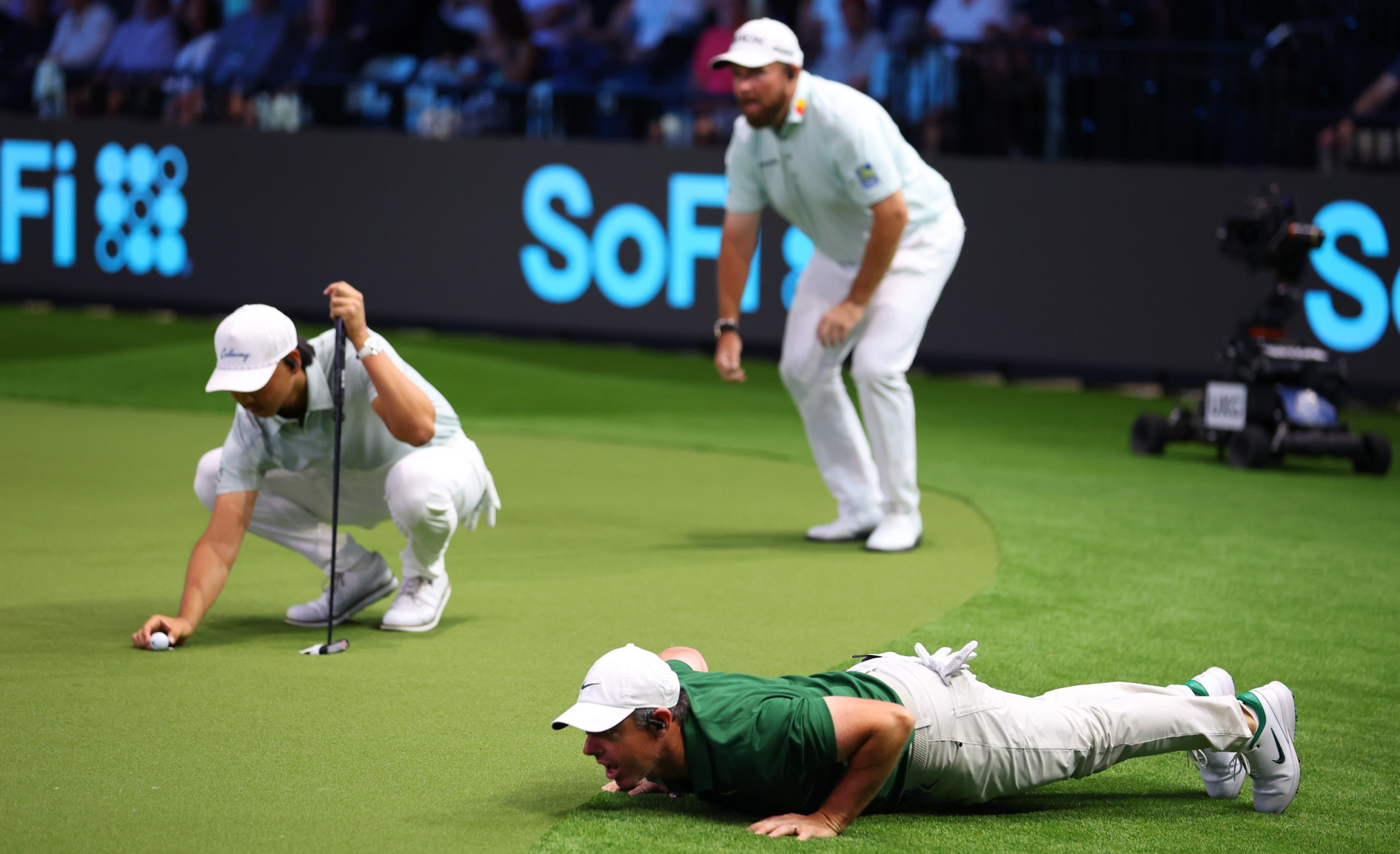 Rory McIlroy checks the green at the TGL.