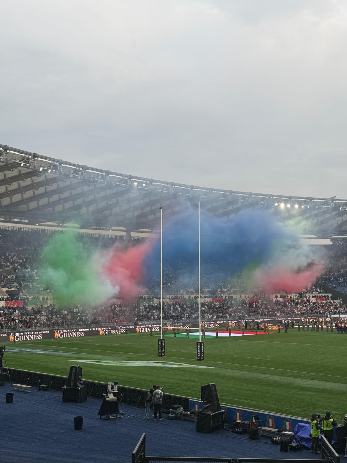 Italy fans at the Stadio Olimpico in Rome before the Six Nations match against England, with tricolour green, white and red smoke filling the stands.